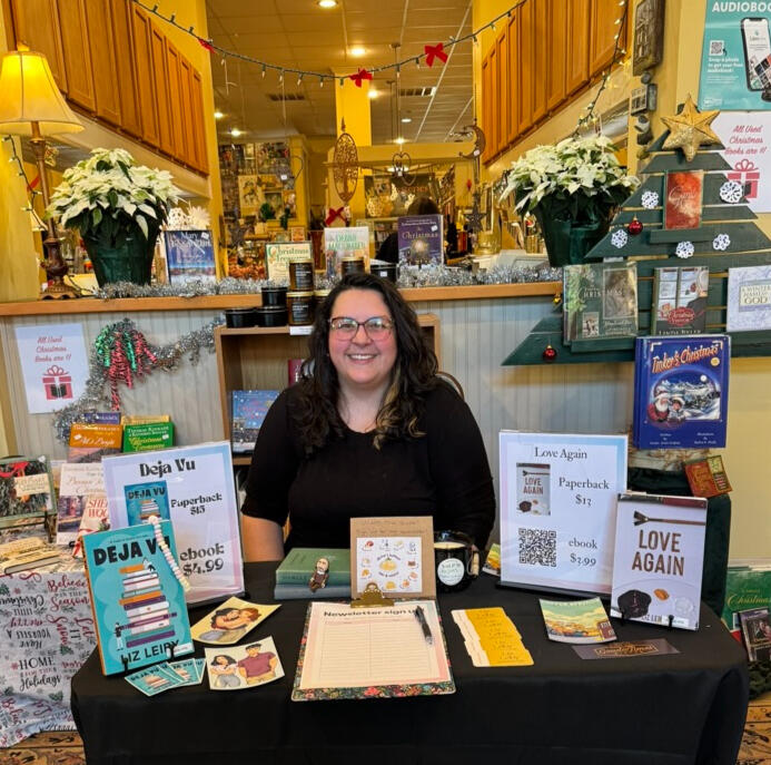 Liz Leiby loading graphic Liz Leiby sits at an author's event in December 2024 surrounded by your books.